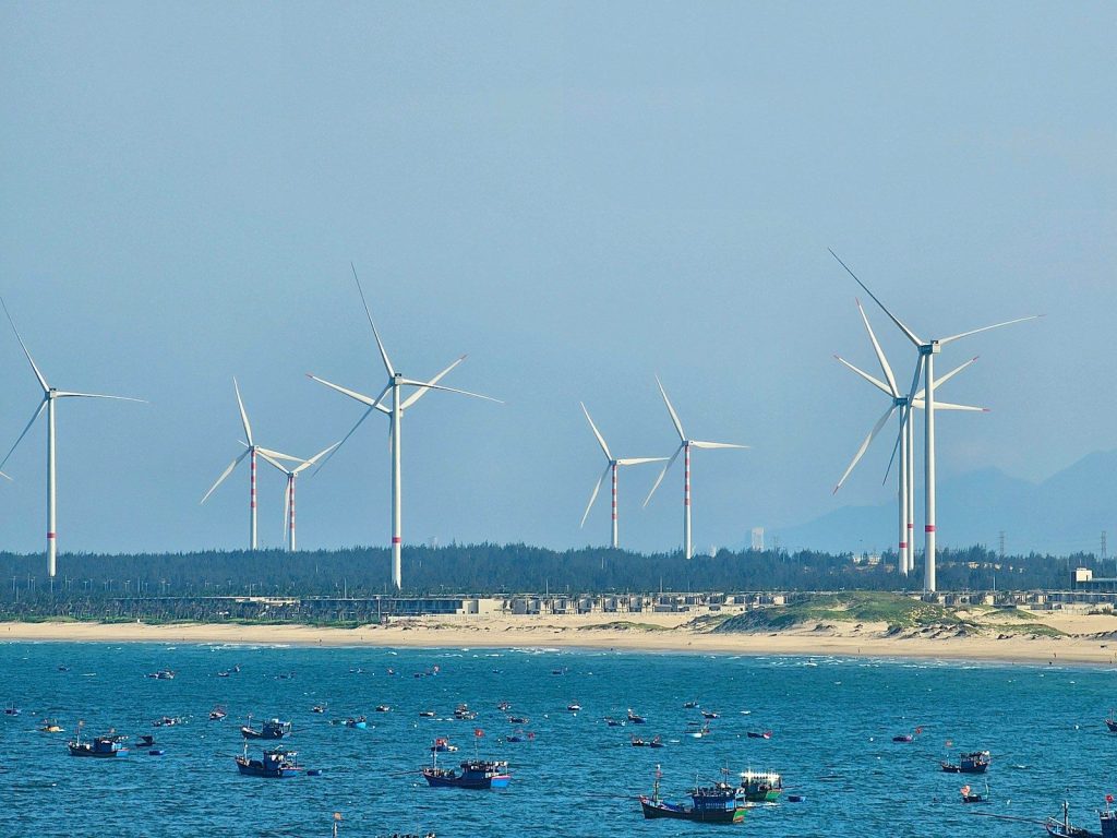 a group of boats floating in a body of water